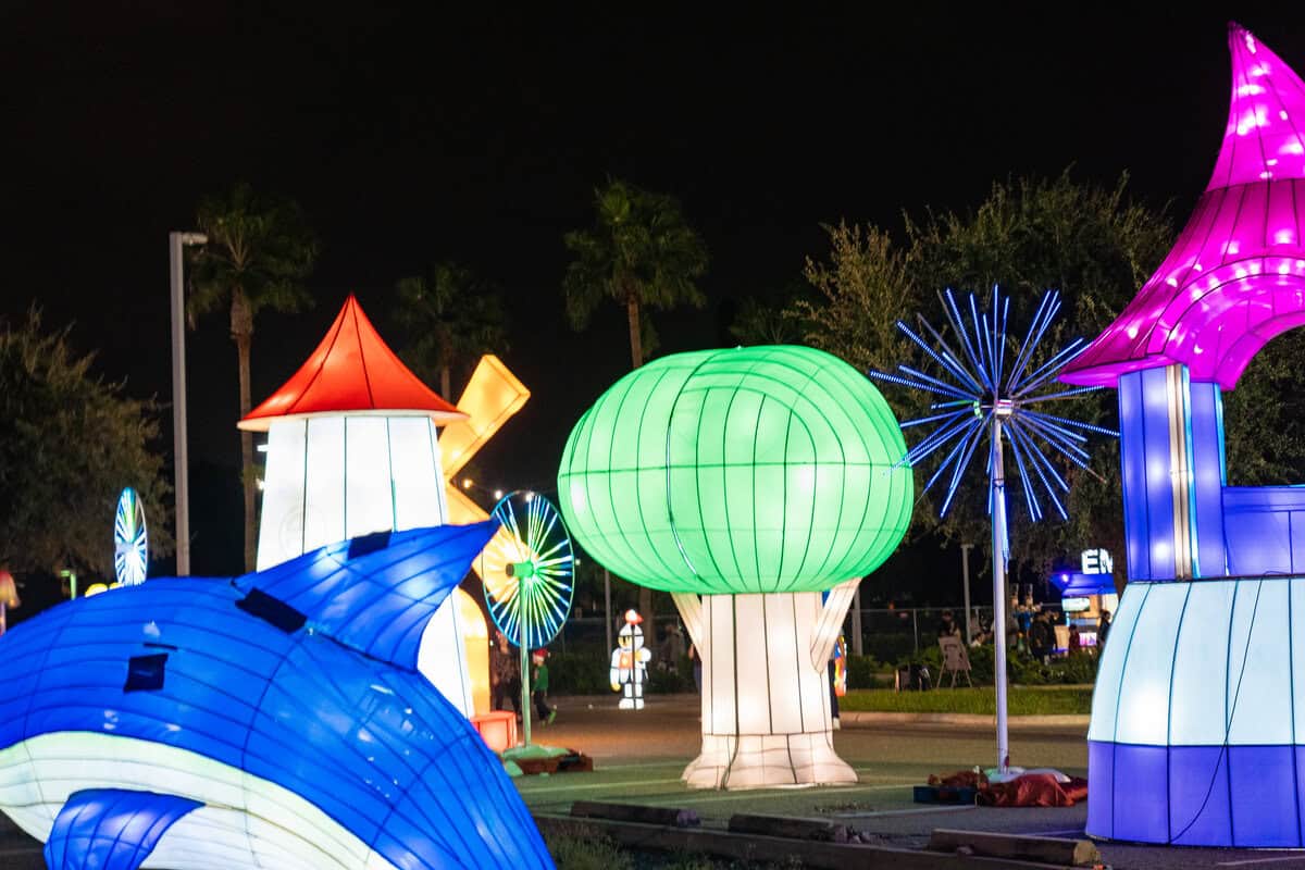 Illuminated outdoor installation with colorful, oversized lanterns