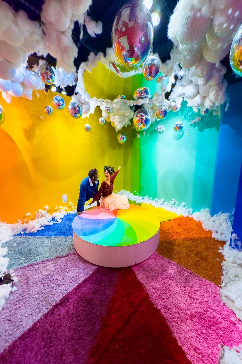 Couple enjoying a hahangout on a room with full of colorful decorations