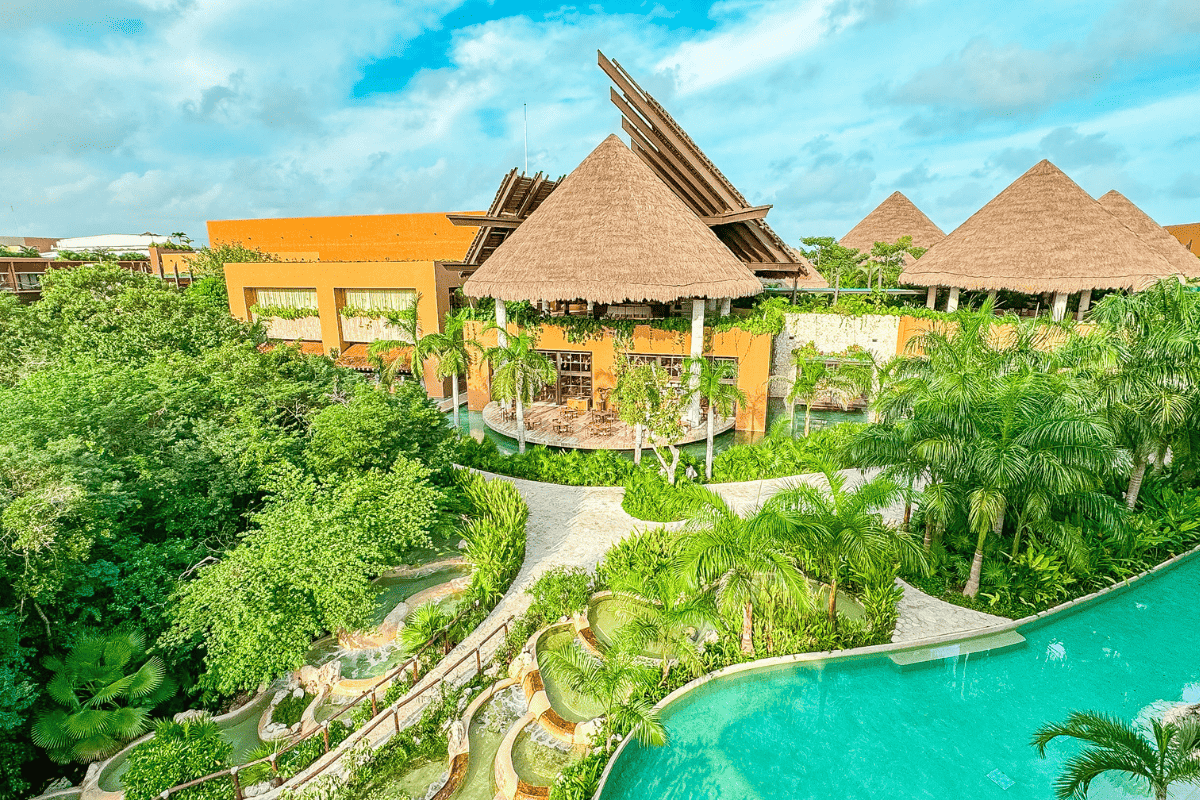 The resort nestled amidst vibrant tropical foliage, creating a serene and picturesque ambiance.
