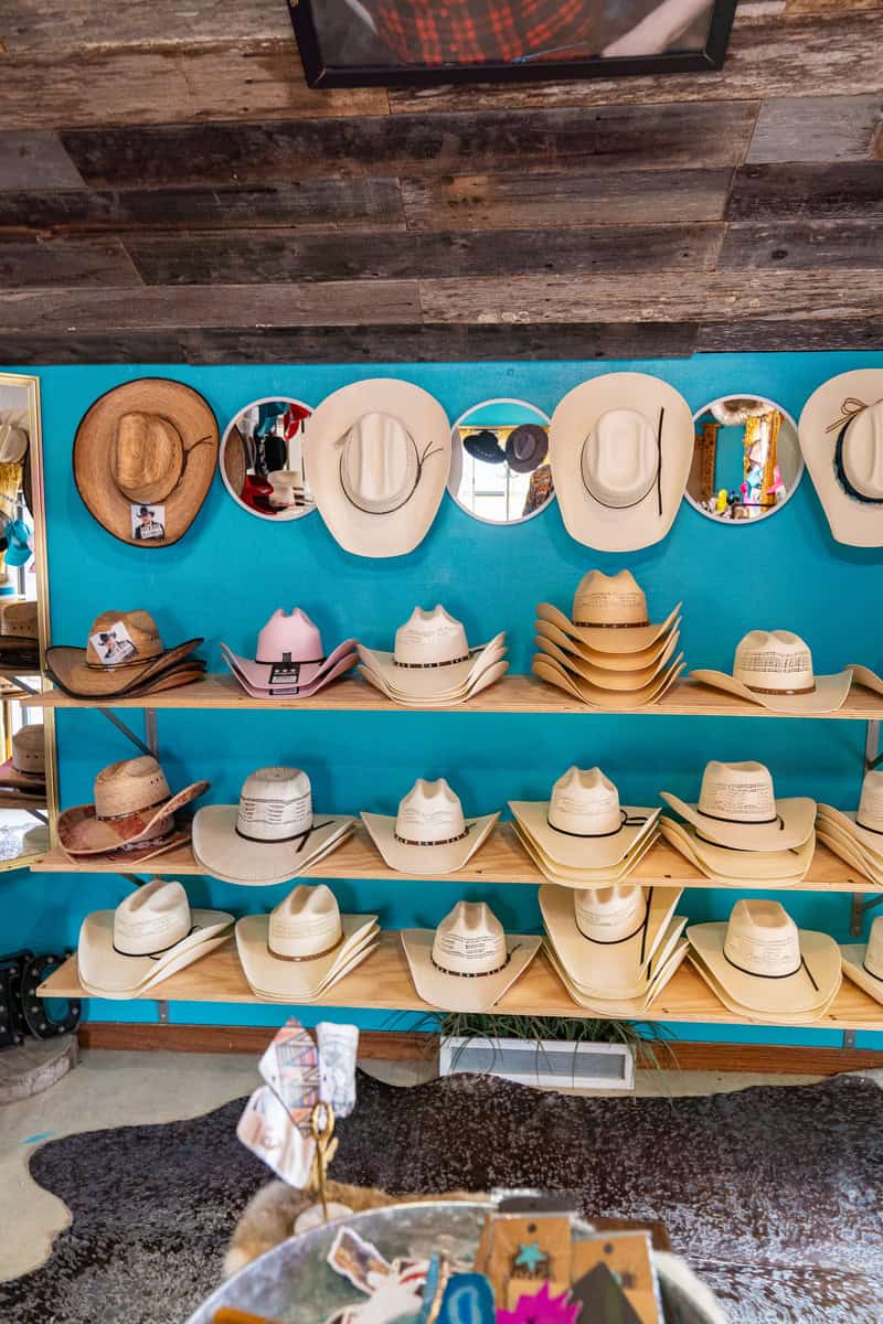 a shelf with hats on it