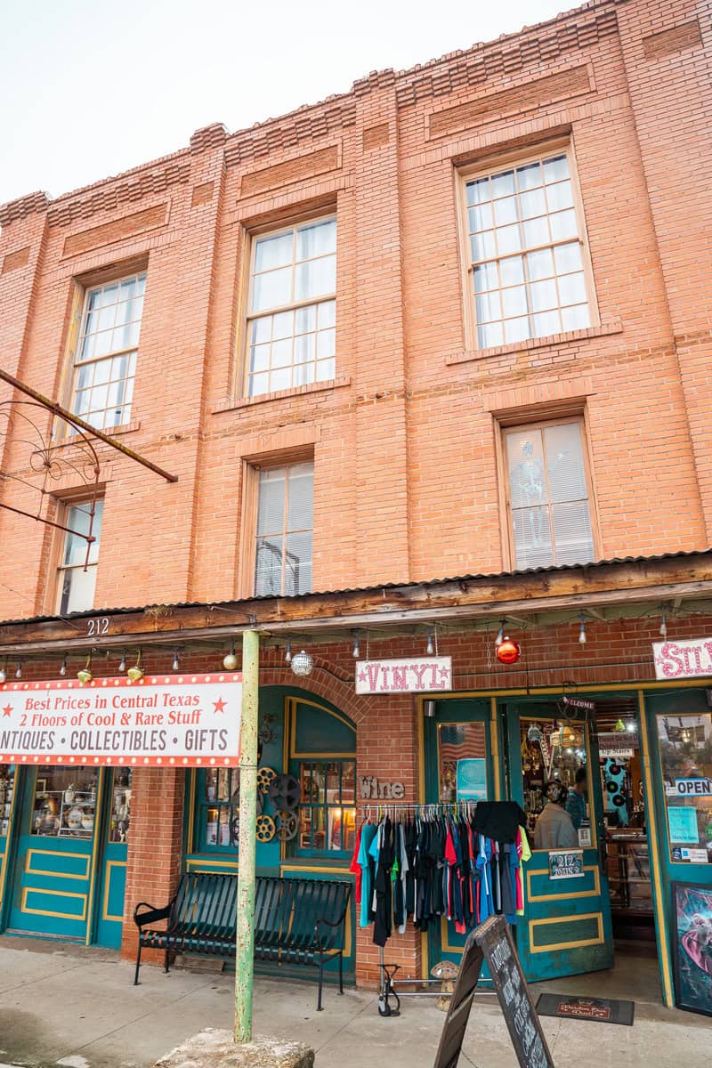 a store front with a sign on the front