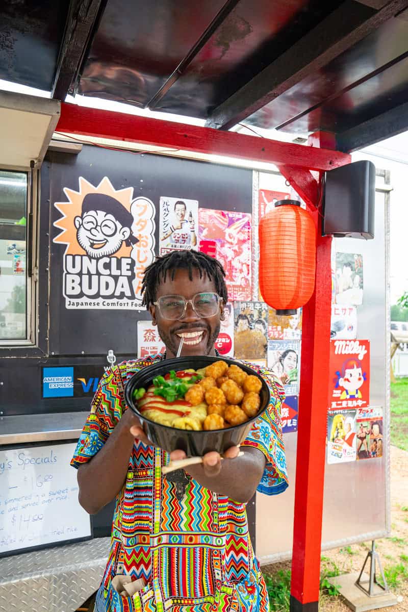 a man holding a bowl of food