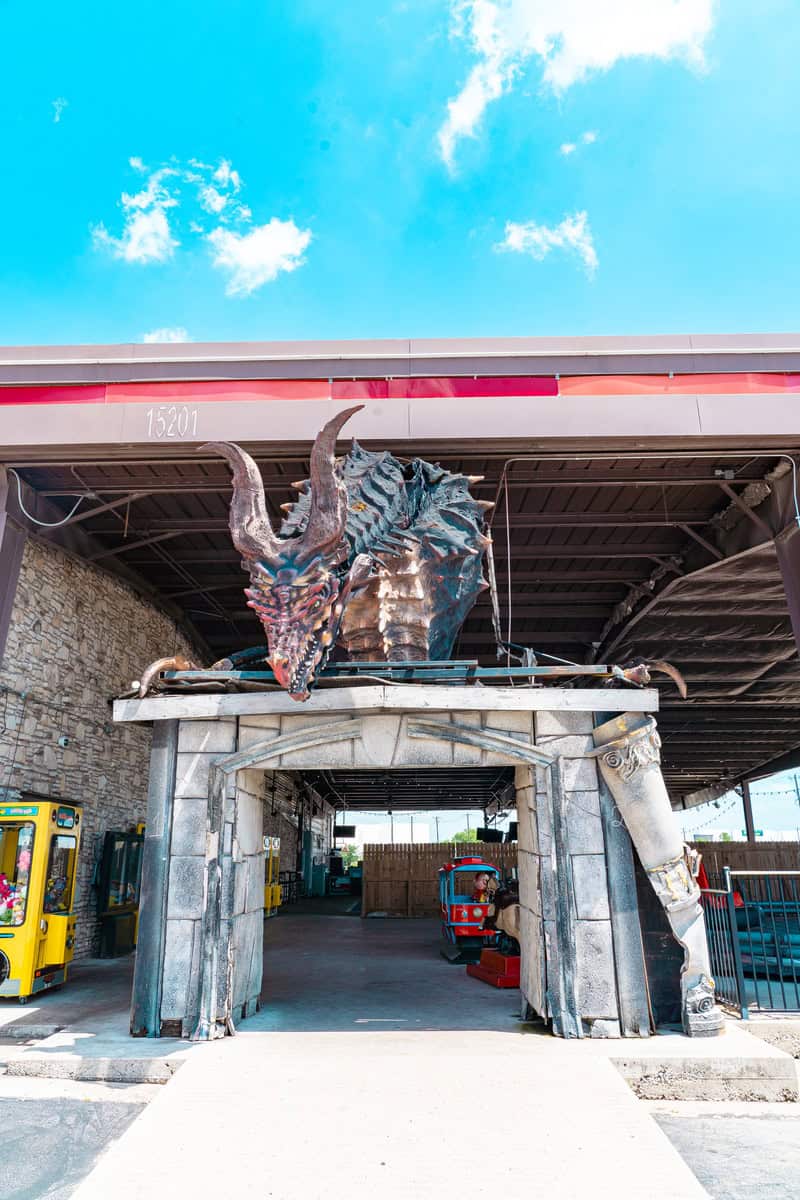 a statue of a dragon on a roof