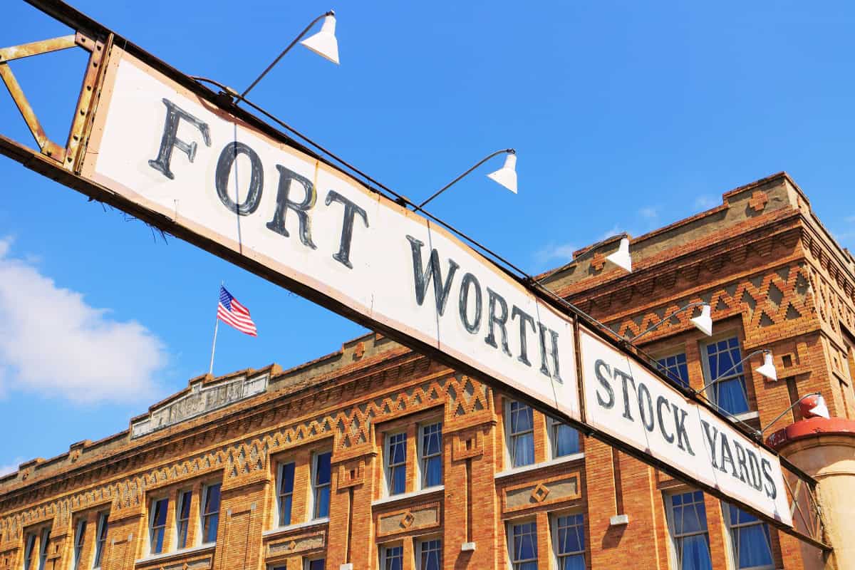 "Fort Worth Stock Yards sign with an American flag