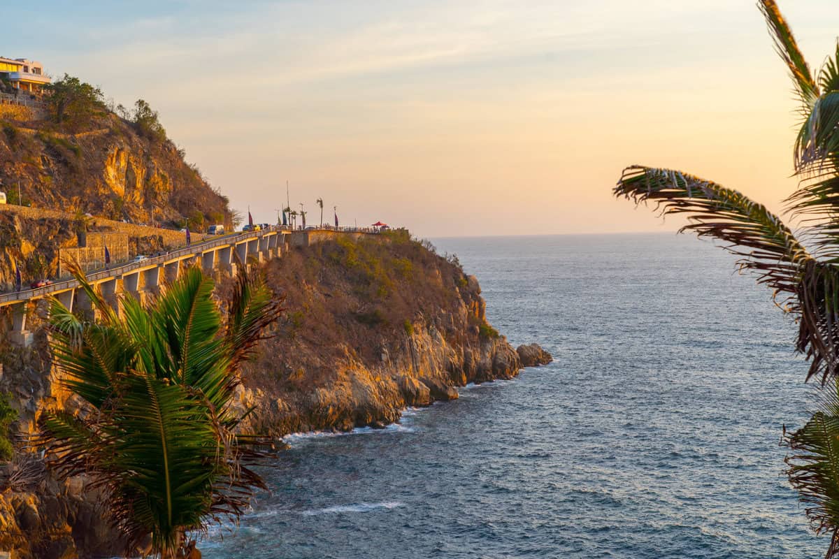 a road on a cliff by the ocean