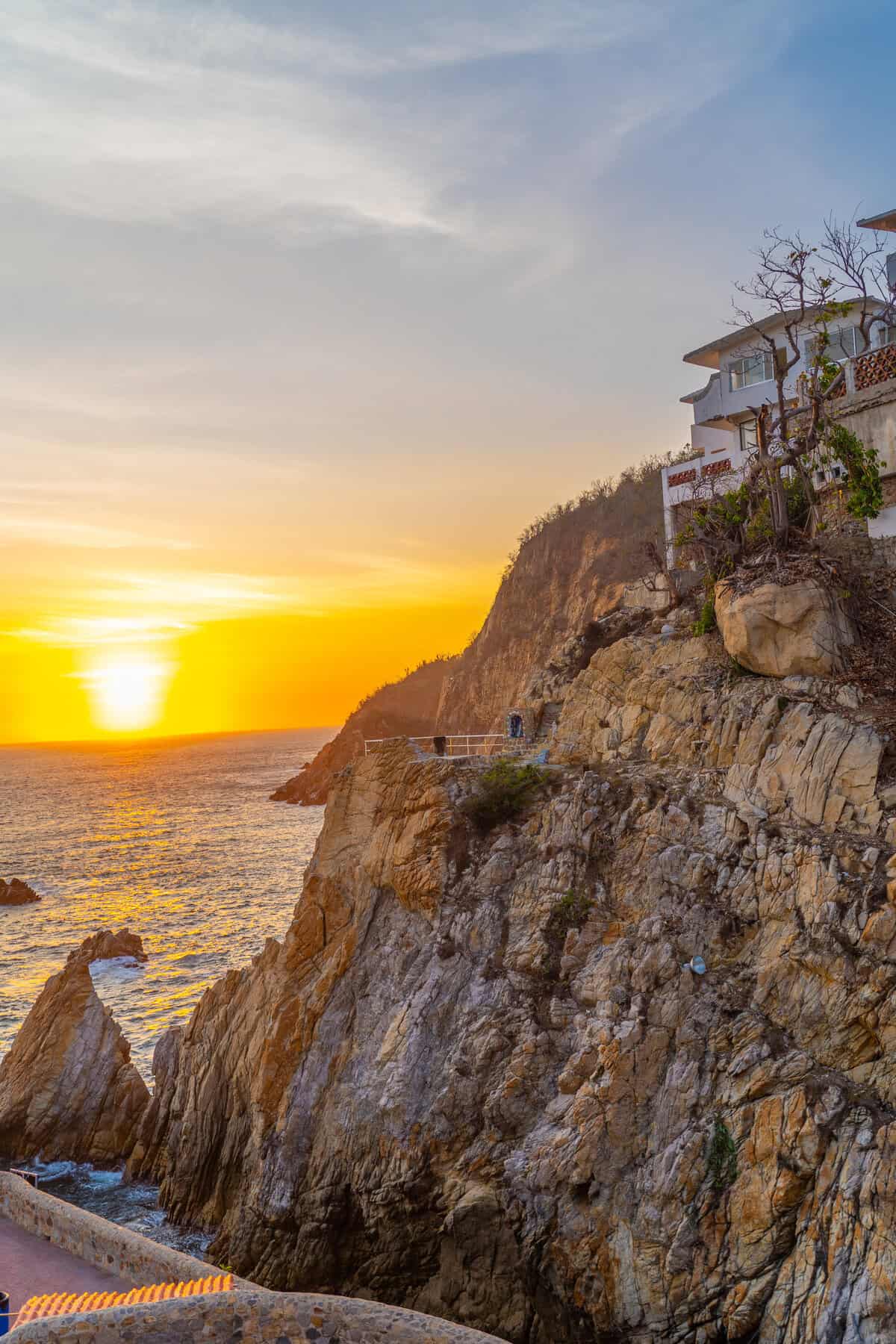 a house on a cliff by the ocean