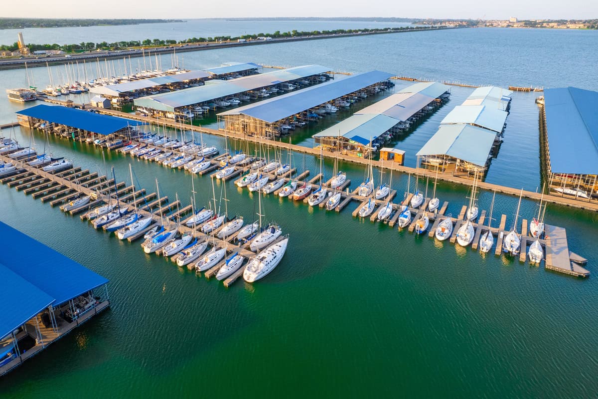 An aerial view of a bustling marina filled with numerous boats