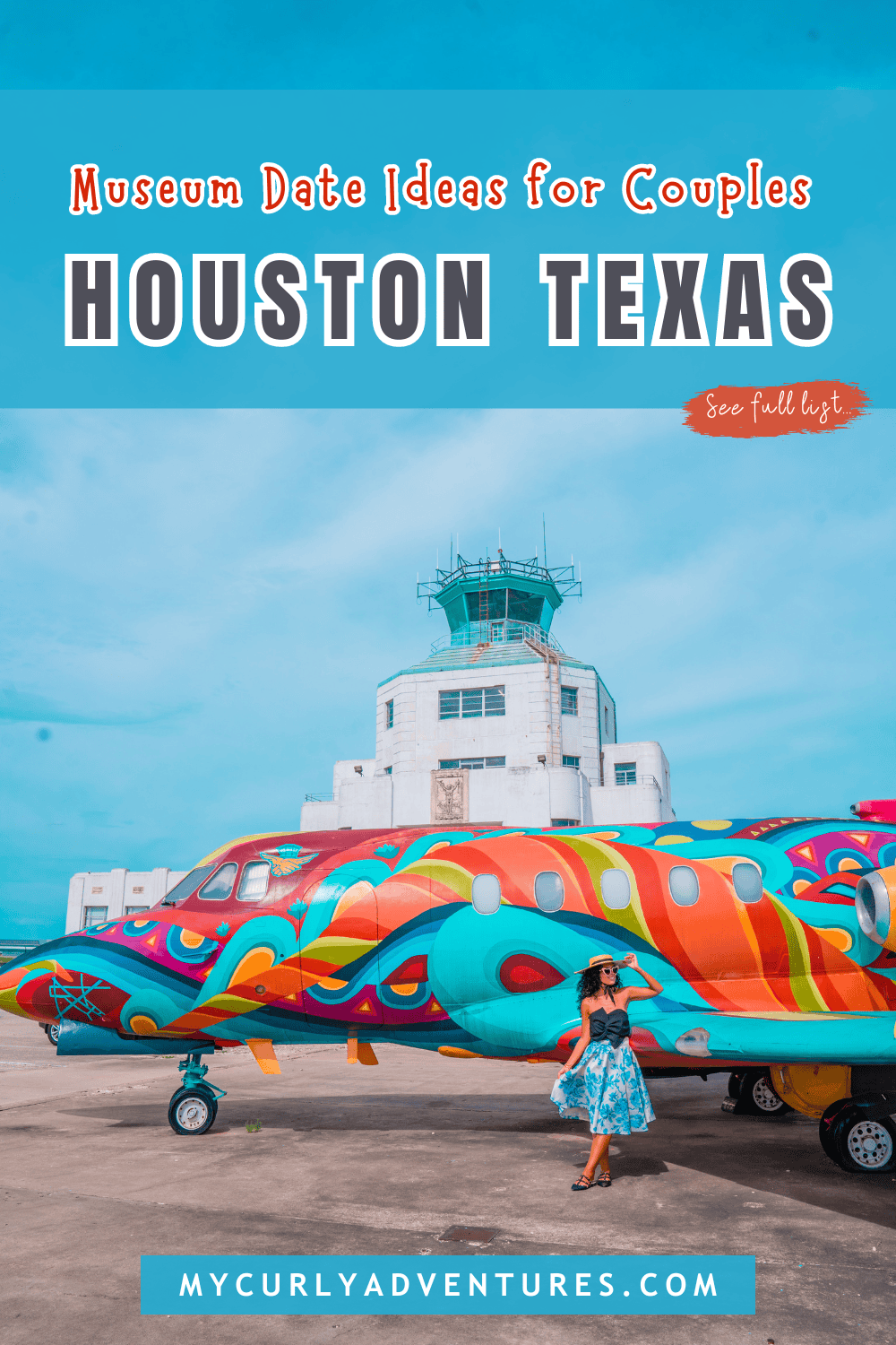 a woman standing in front of a colorful plane