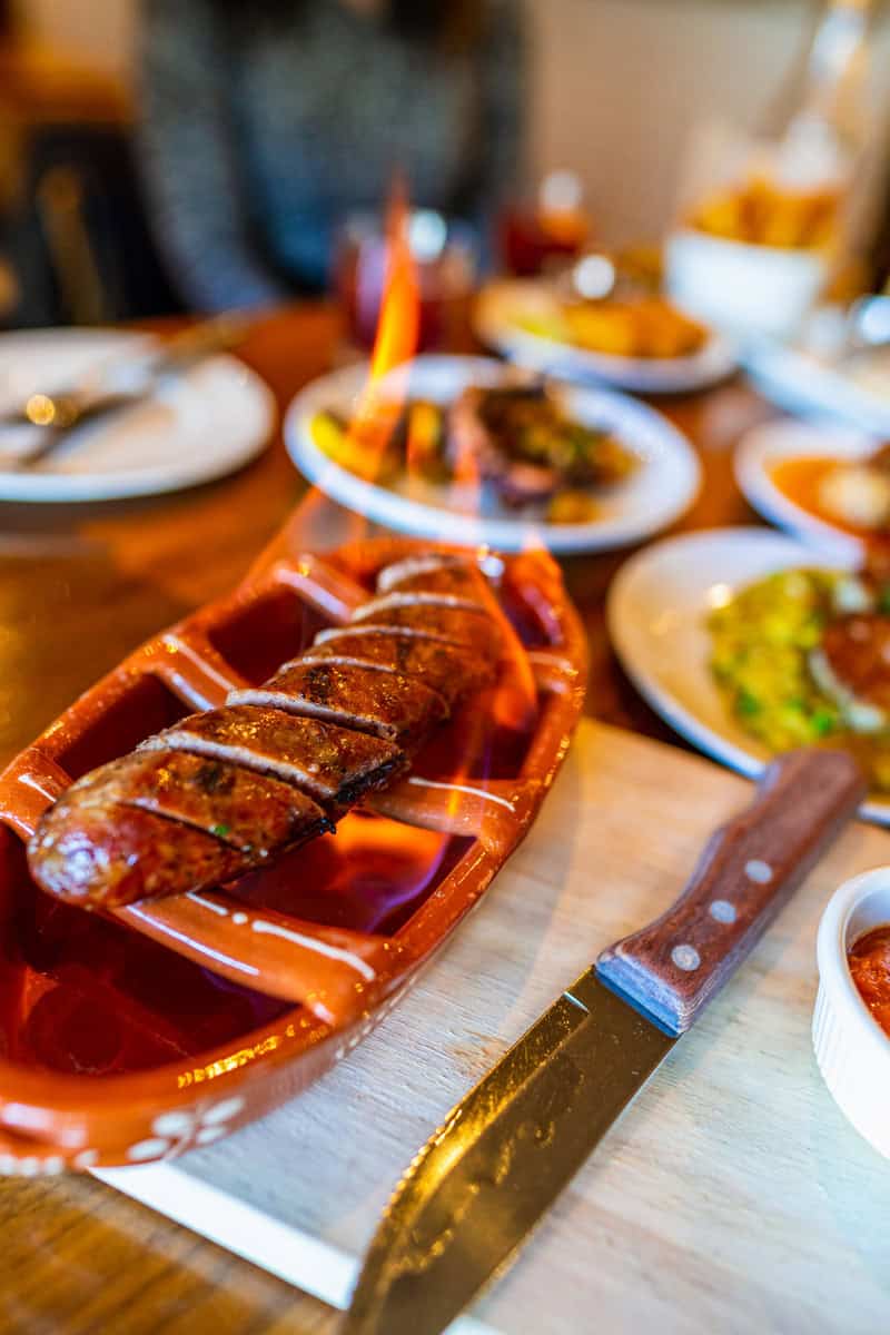 A plate of food and a knife on a table