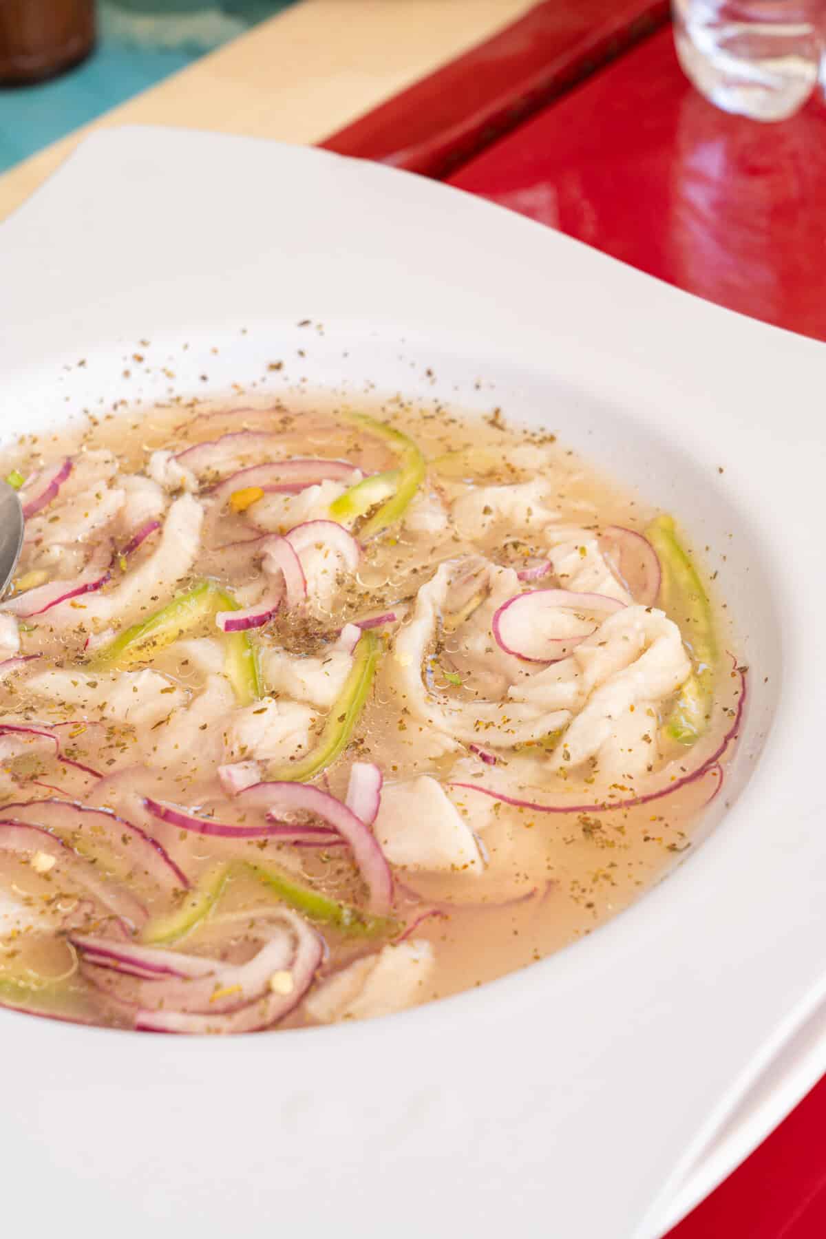 a bowl of soup with vegetables and spices