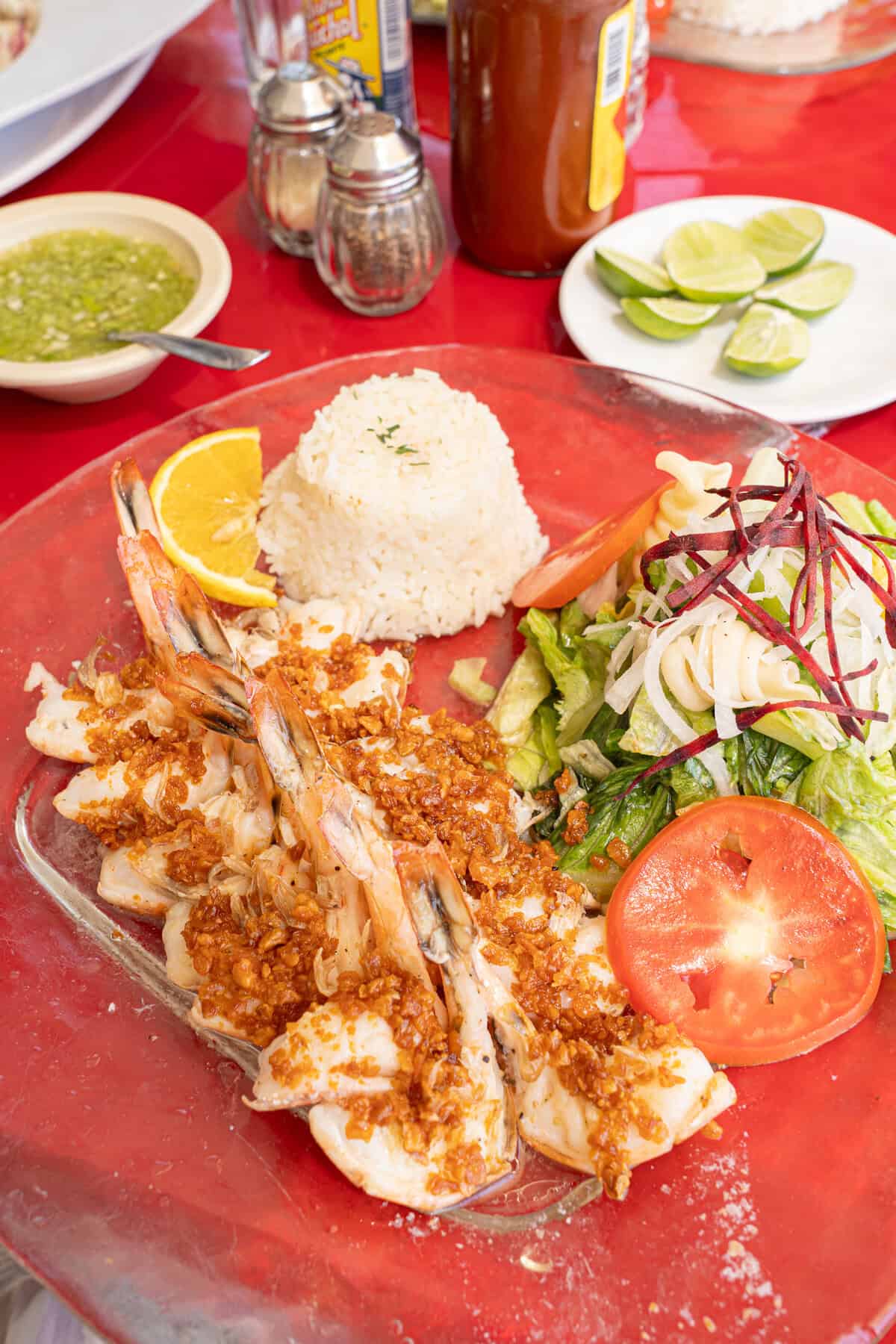 a plate of food on a red table