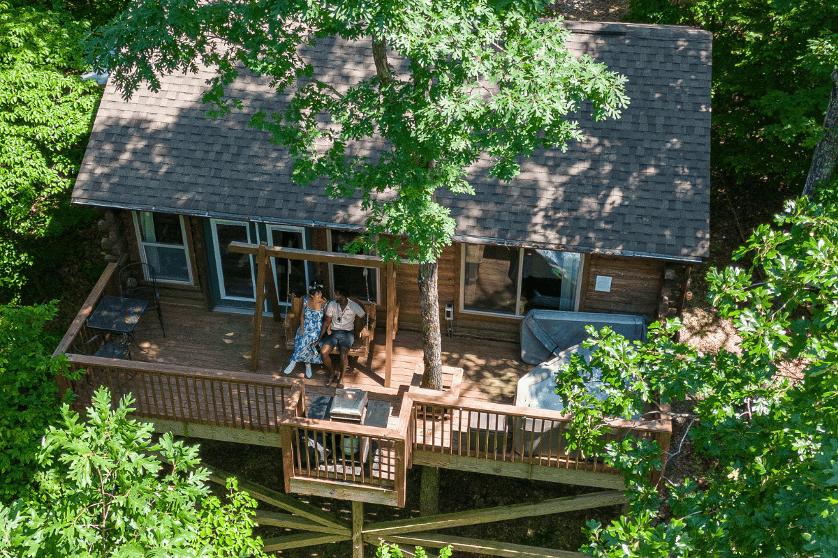 a couple of people on a deck of a house