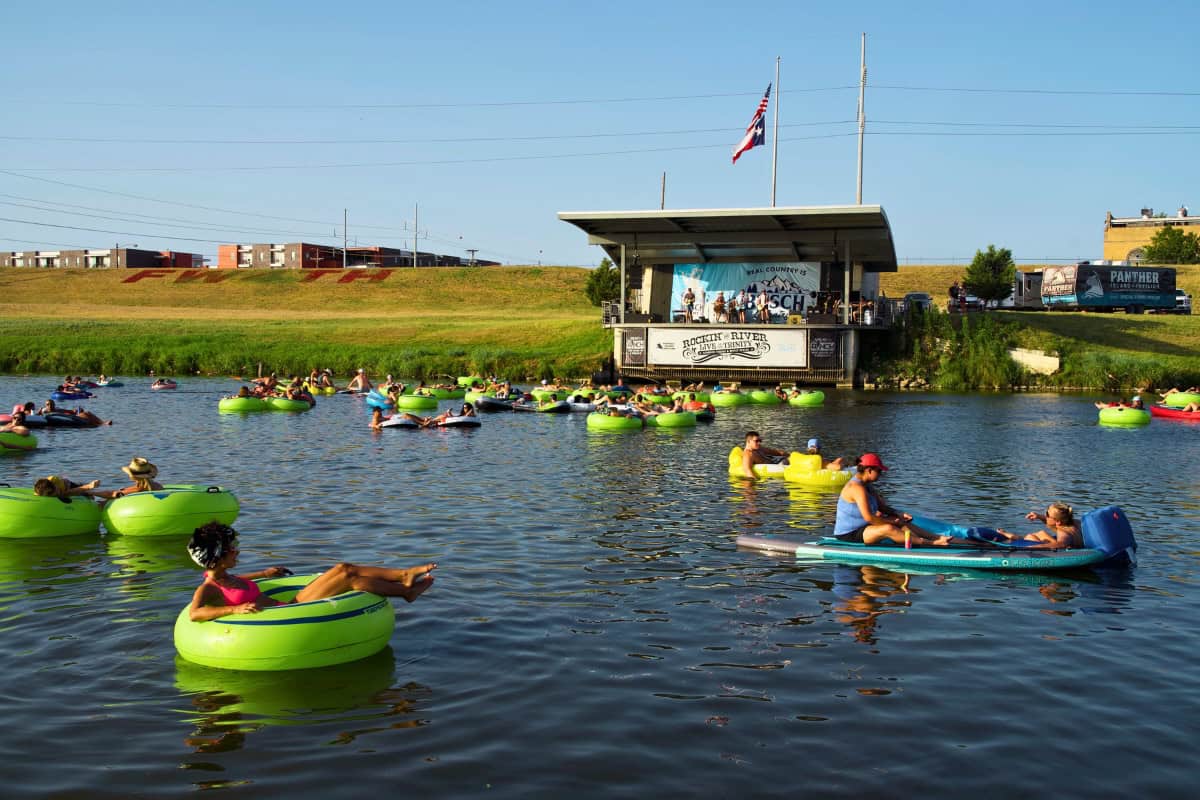 a group of people in floating rafts - fun date ideas in fort worth