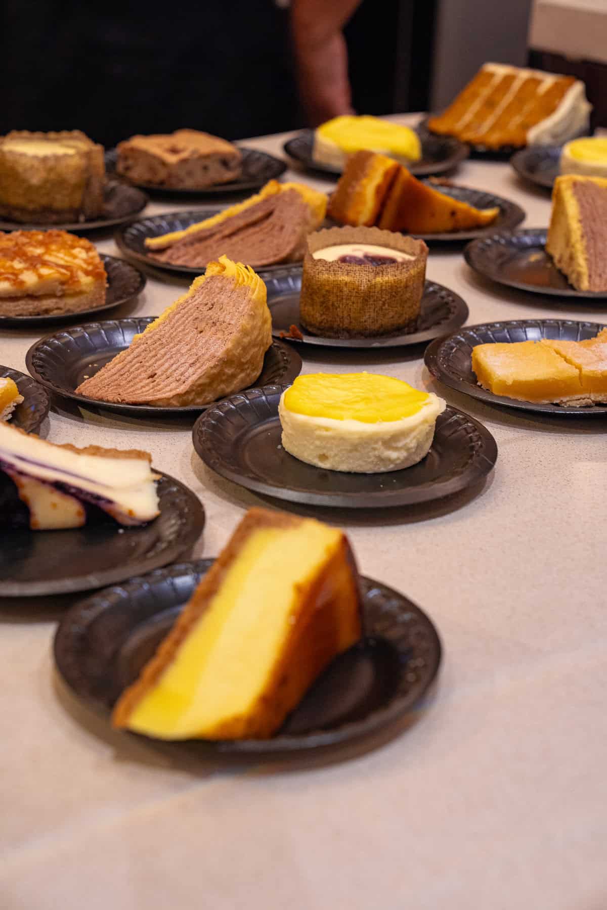 a table full of plates of desserts