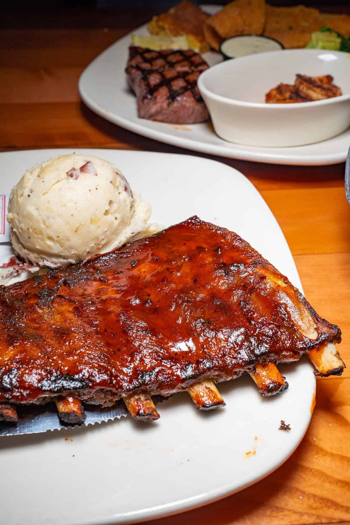 a plate of ribs with sides