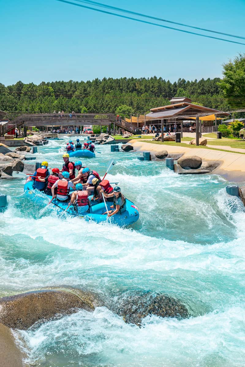 a group of people on a raft in a river