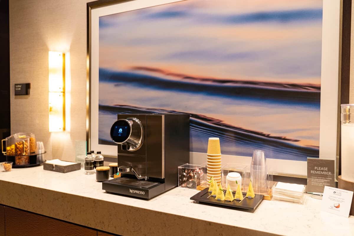 a coffee machine and coffee cups on a counter