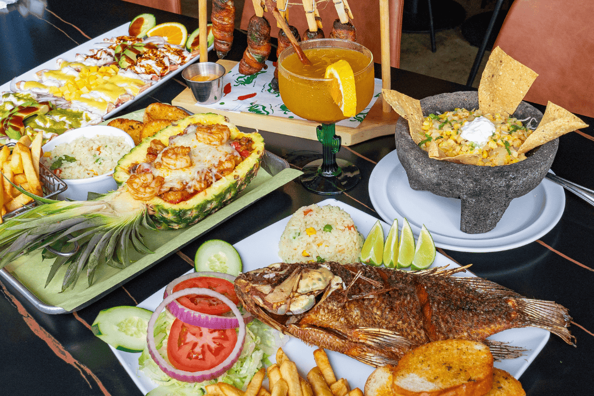 A variety of dishes including a pineapple seafood bowl