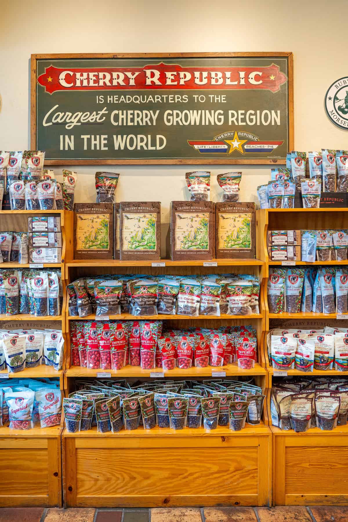 Shelves stocked with Cherry Republic products under a sign claiming the largest cherry growing region.