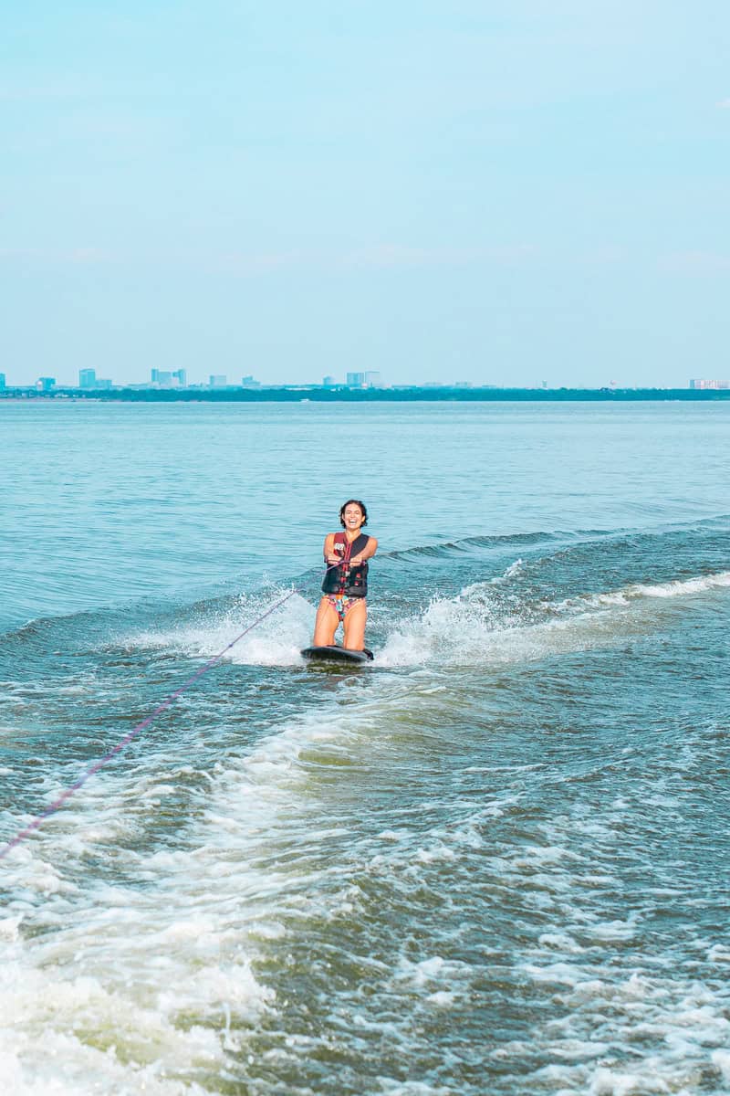 A person is water skiing in a lake