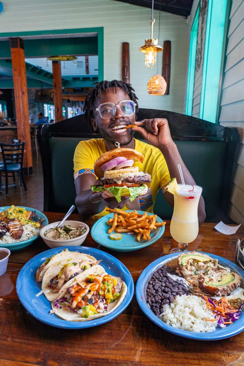 Person at table with assorted dishes