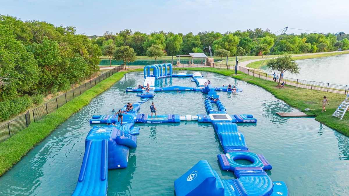 Outdoor water park with inflatable obstacle course