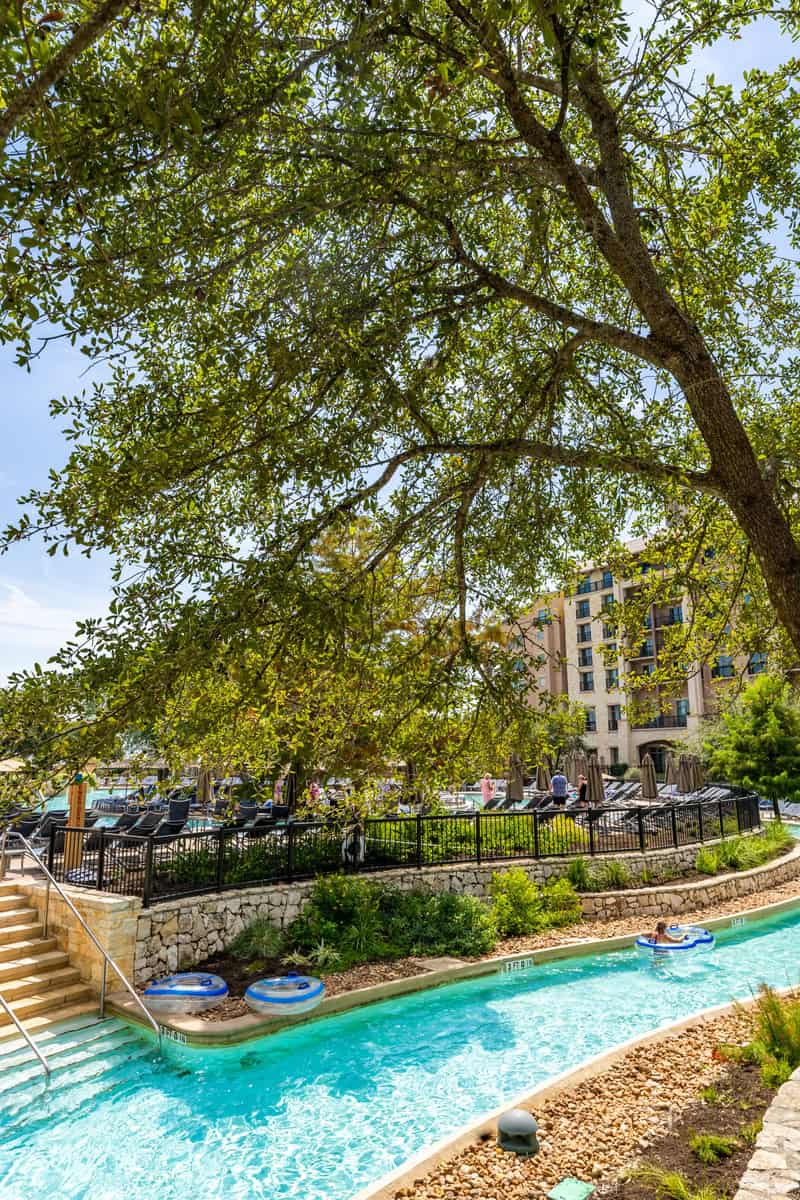 A serene riverside pool with loungers 