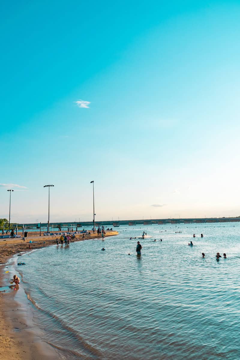 Beach scene with people swimming