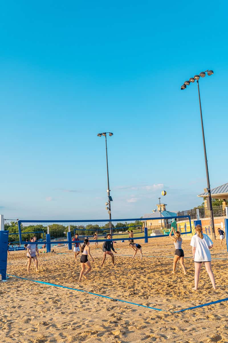 People playing beach volleyball