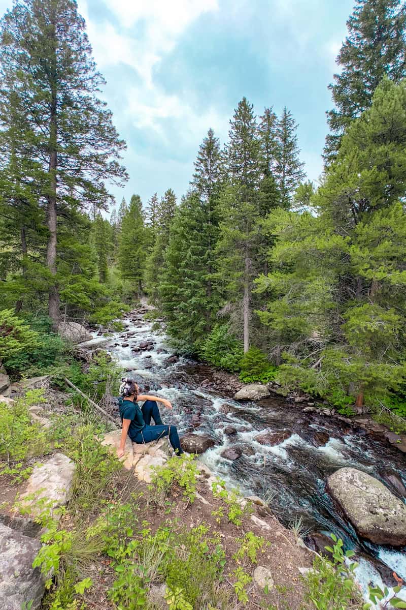 A person sitting on a rock