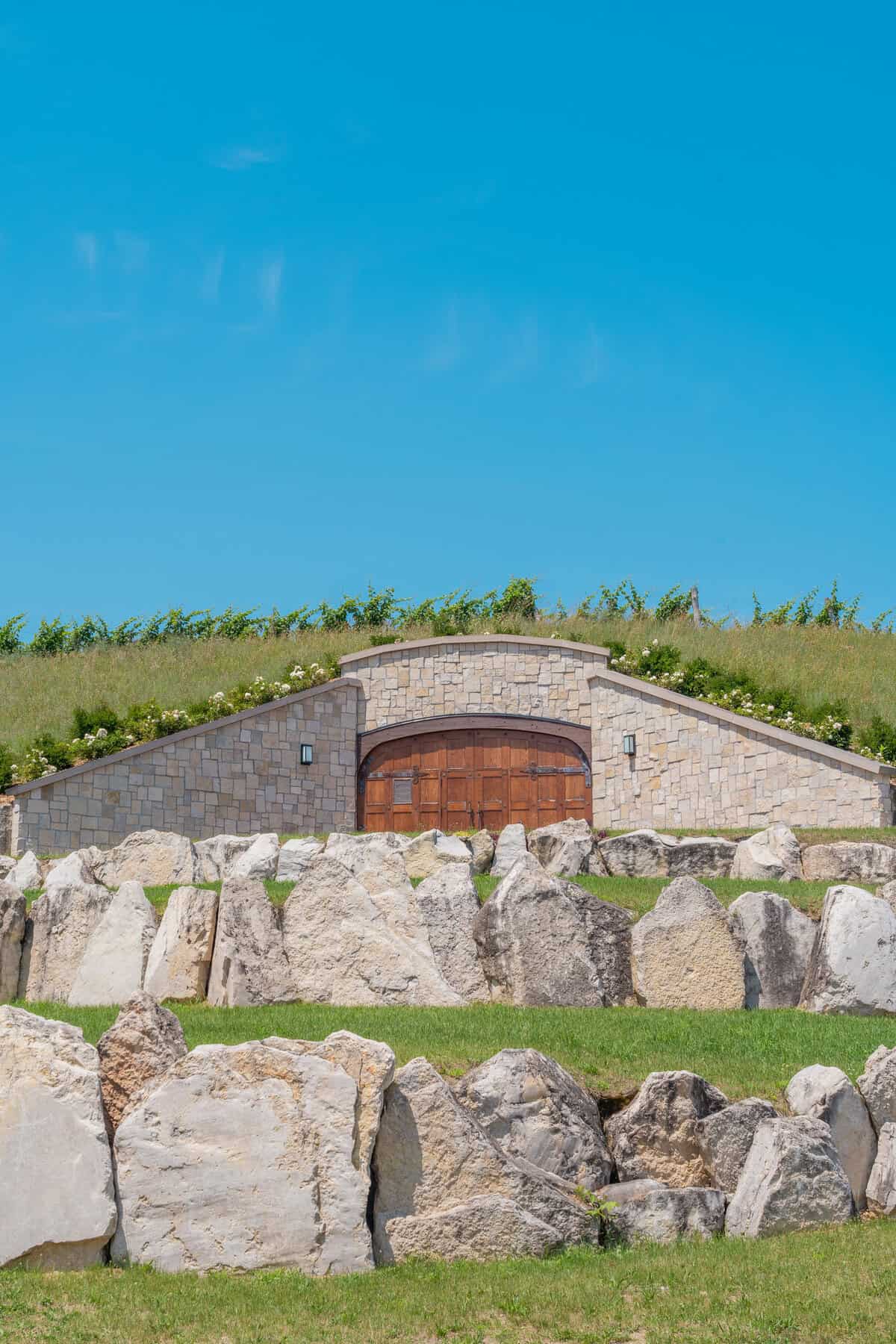 Stone building with arched wooden door 