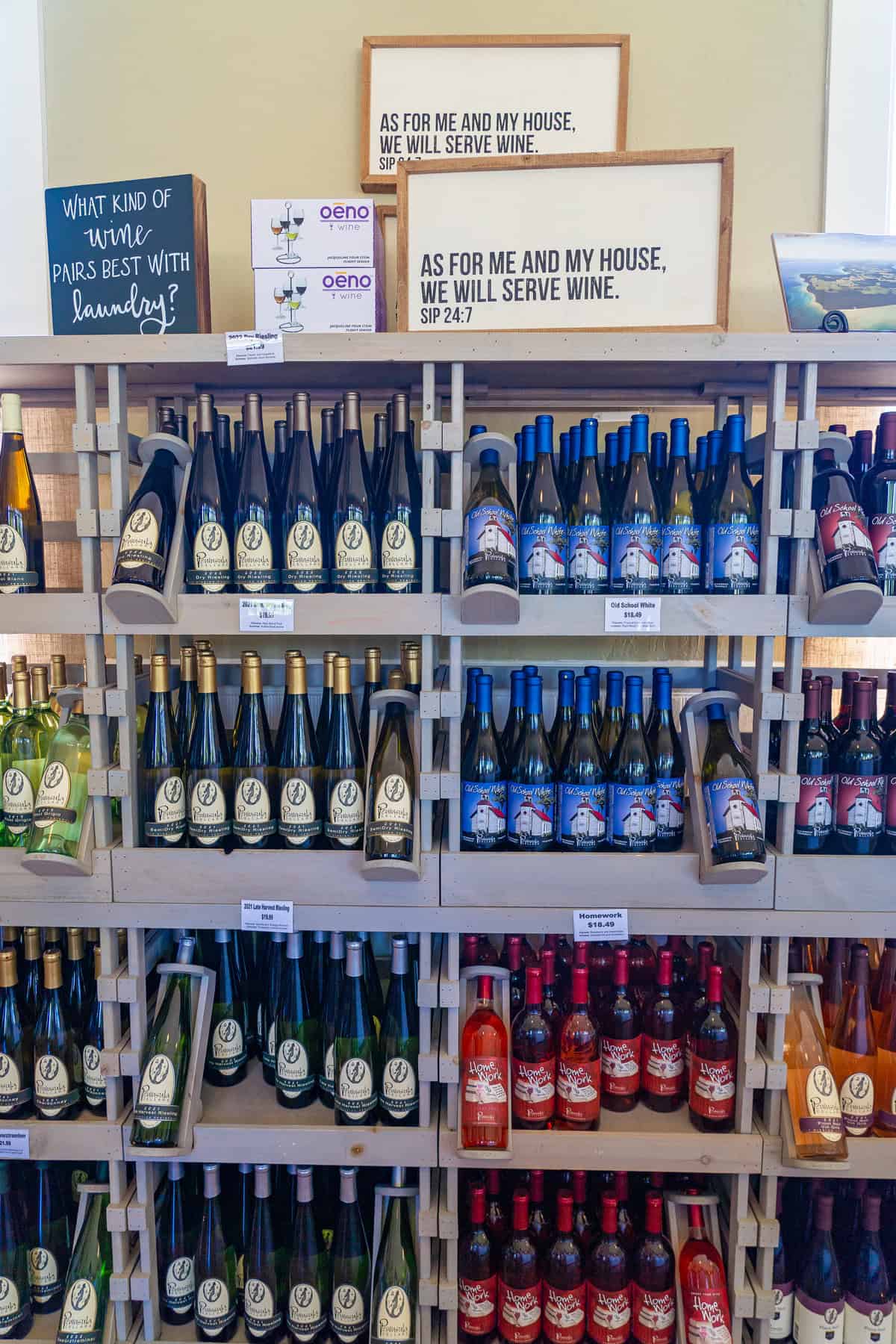 Wooden shelves stocked with various wine bottles