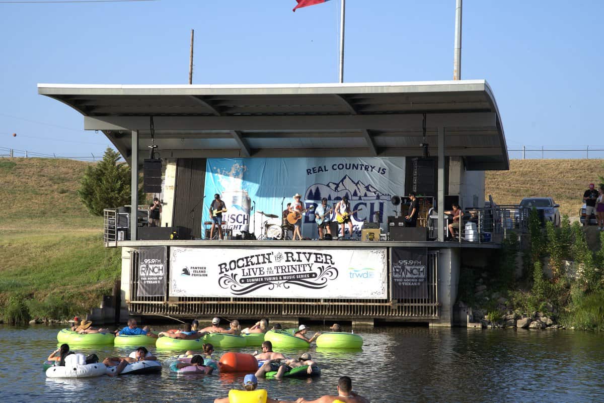 A live band performs on stage at Rockin' the River