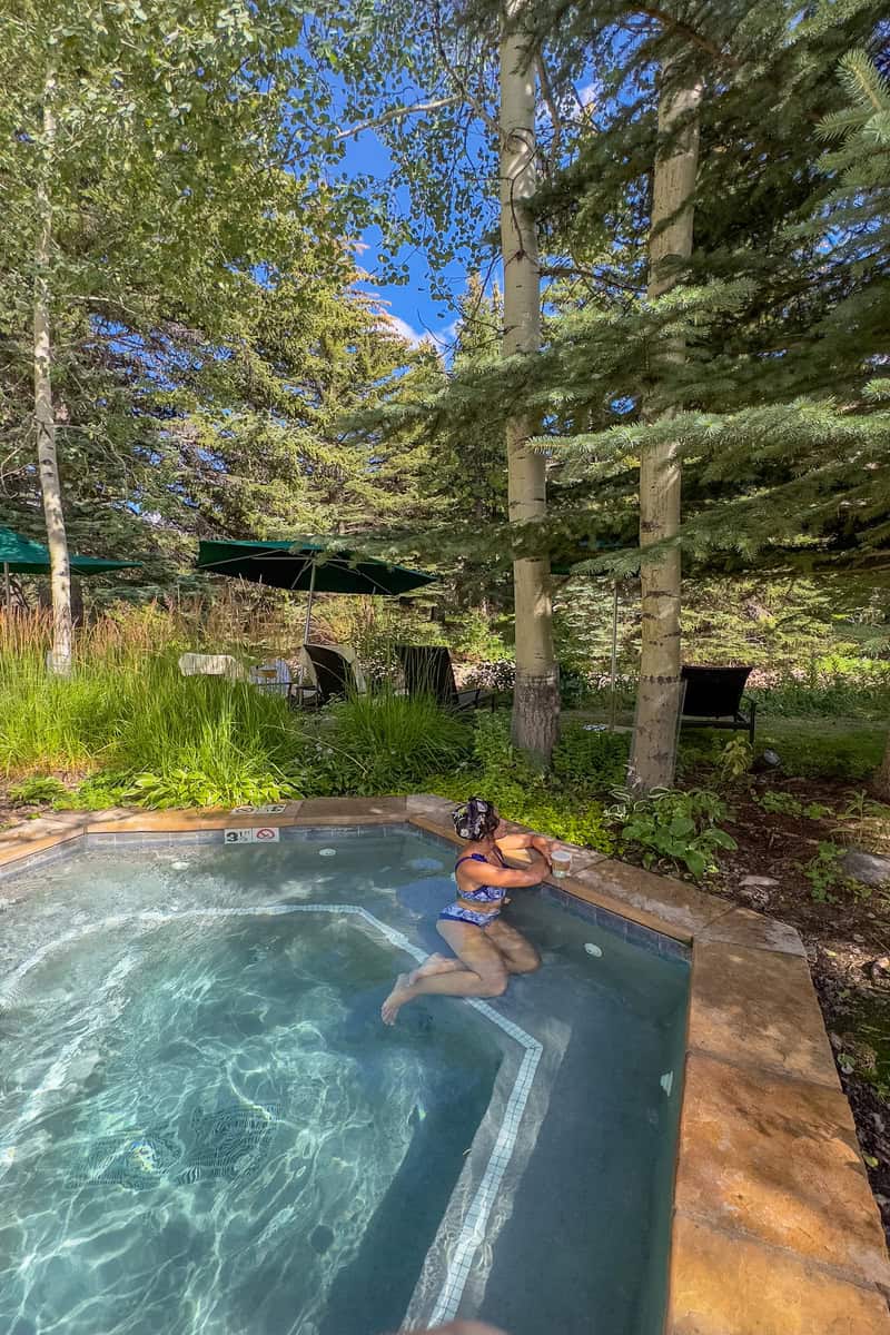 Person relaxing in an outdoor hot tub