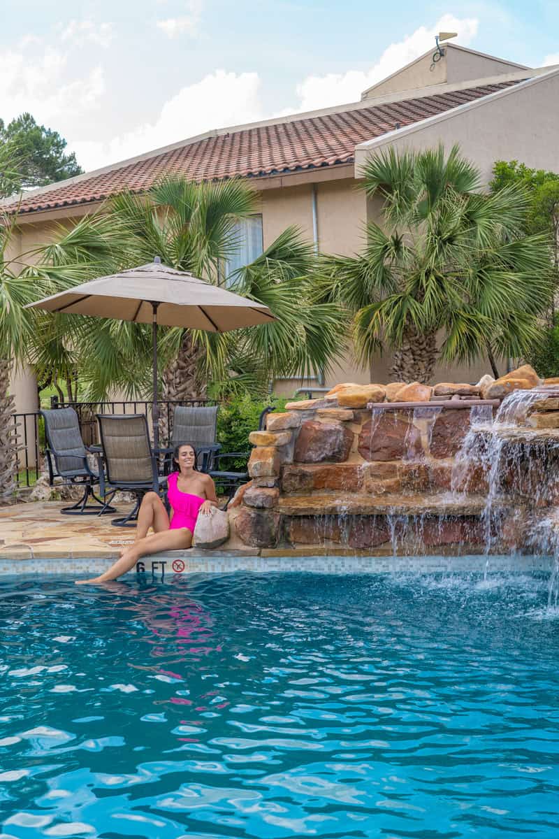 person relaxing by a pool