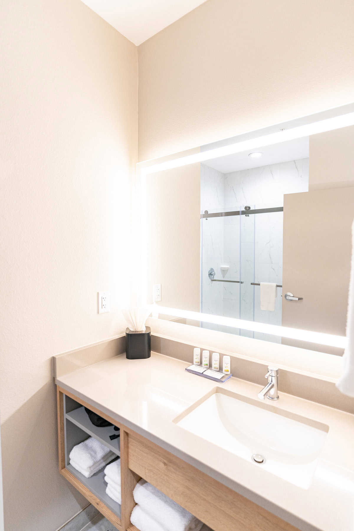 A bright, modern bathroom with a mirror