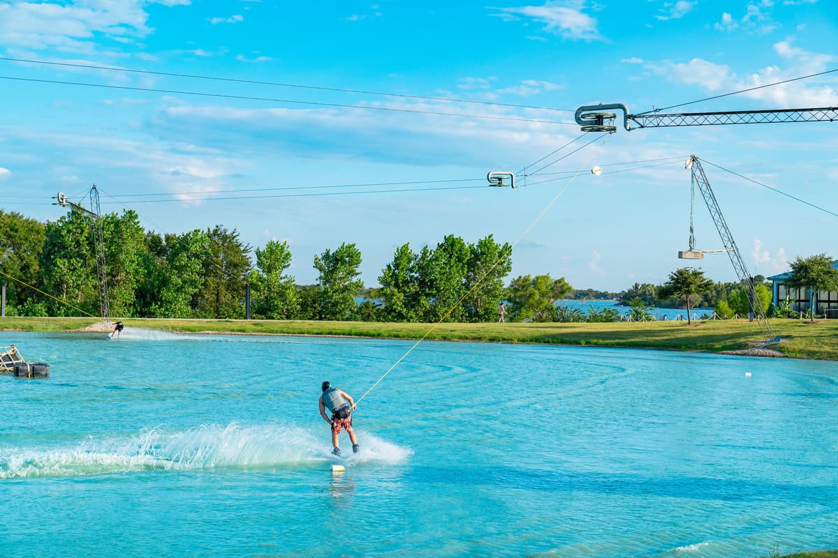 Cable wakeboarding on a blue lake