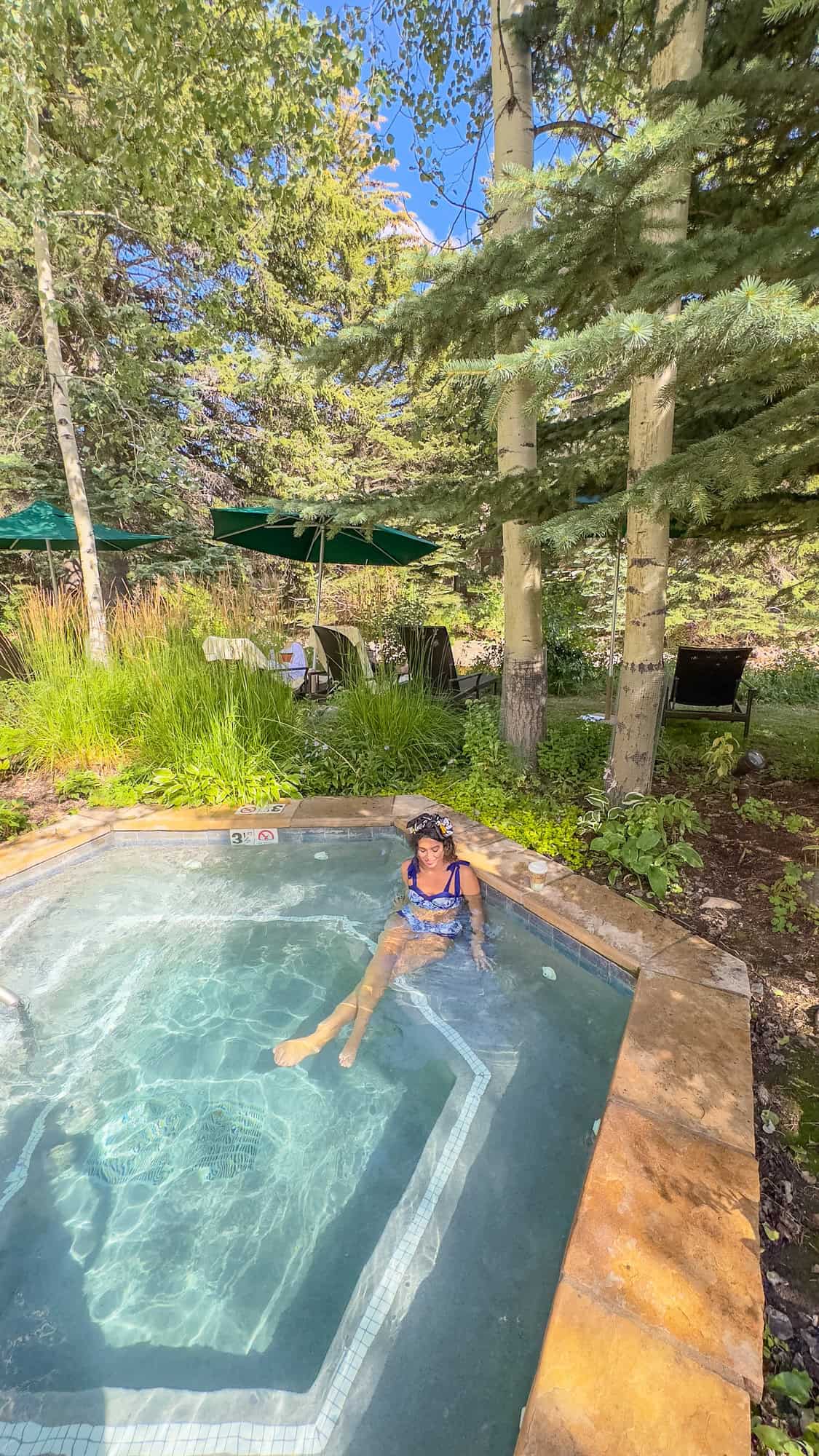 Person relaxing in an outdoor hot tub