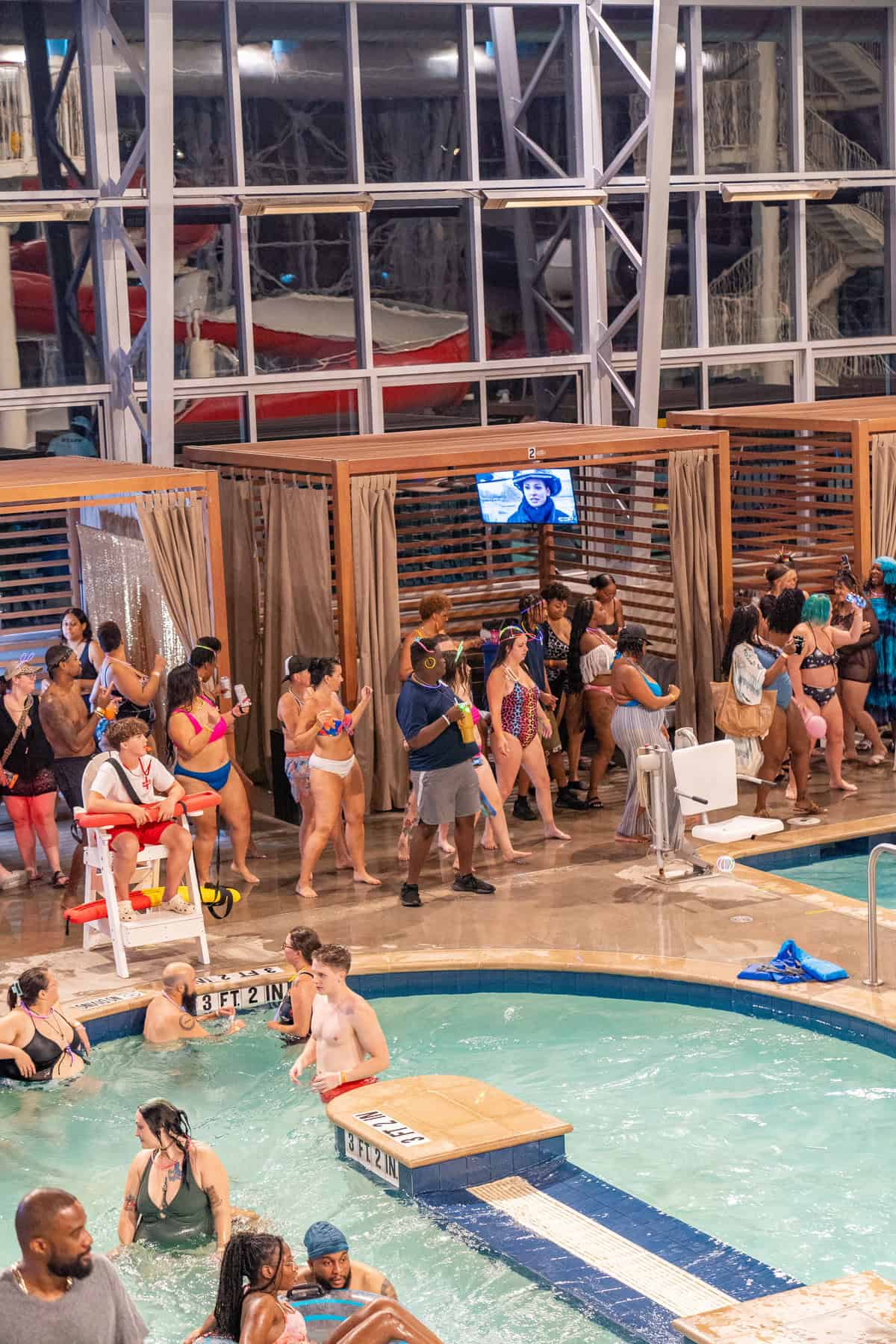 People enjoying an indoor pool