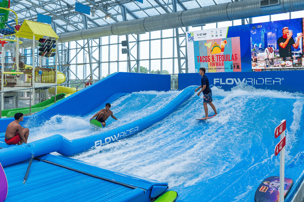 Person surfing on a FlowRider artificial wave machine