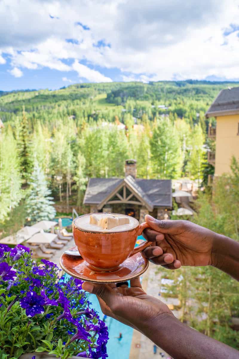 Person holding a cup of tea