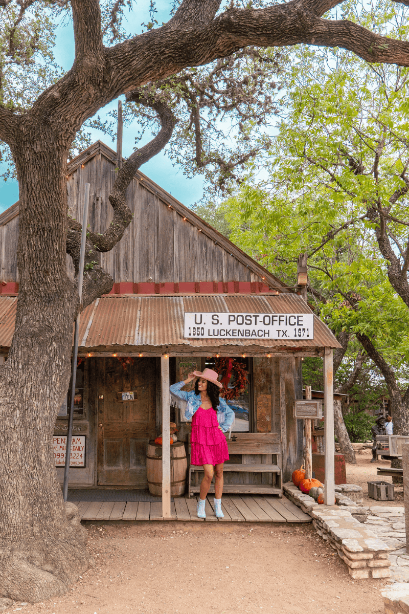 Person in a pink dress and cowboy boots