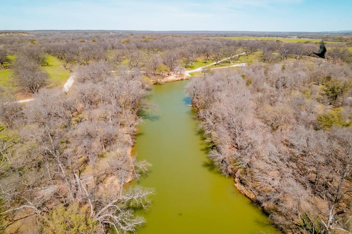  Aerial view of a winding river surrounded by lush green trees