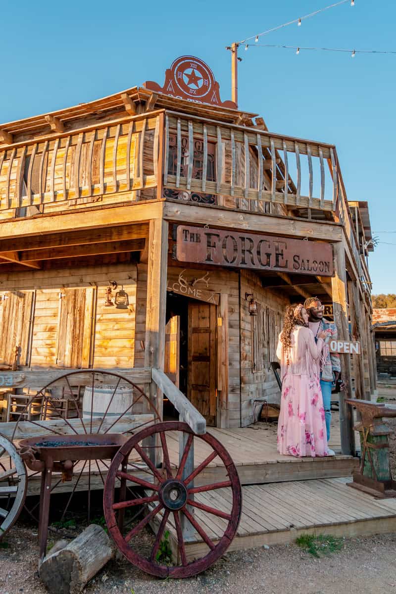 A wooden Wild West-style building labeled "The Forge Salon"