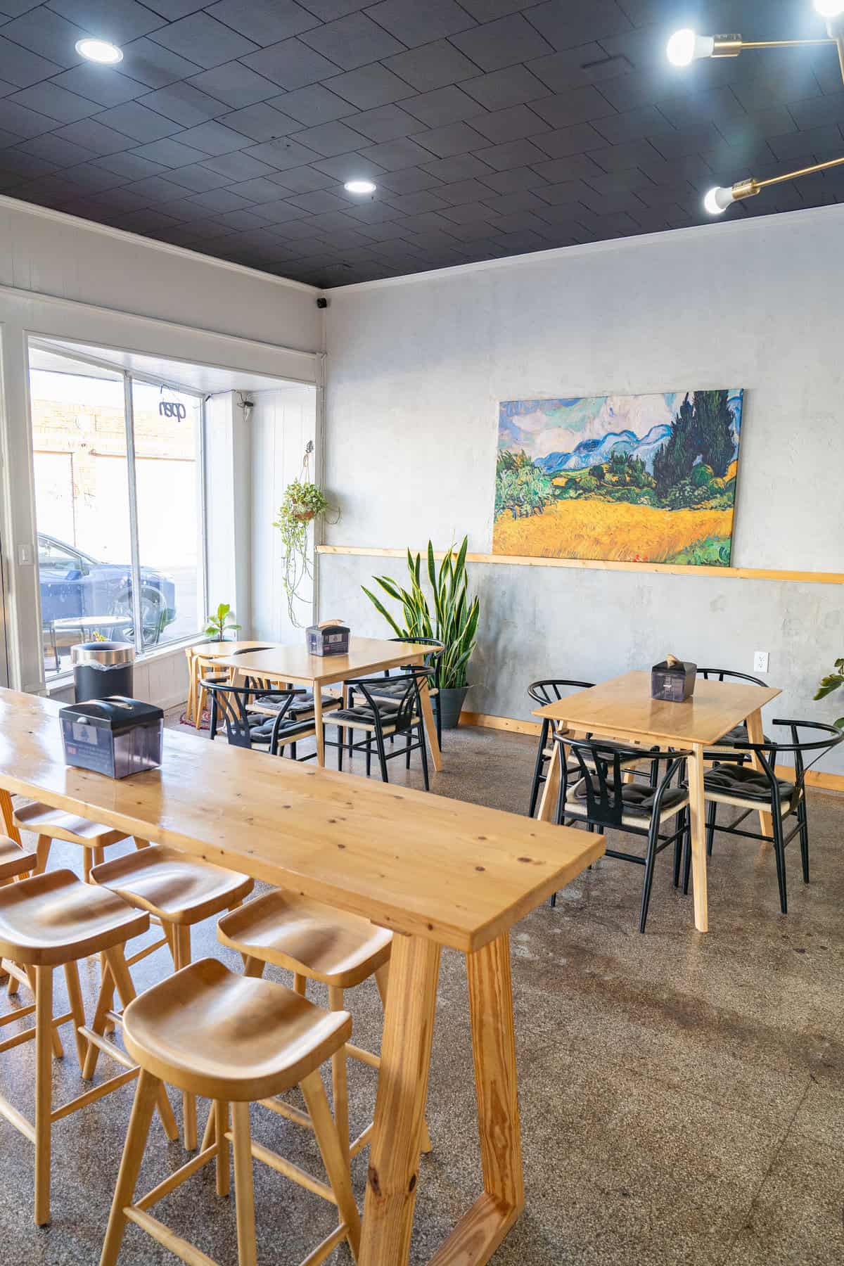  A cozy restaurant featuring wooden tables and chair