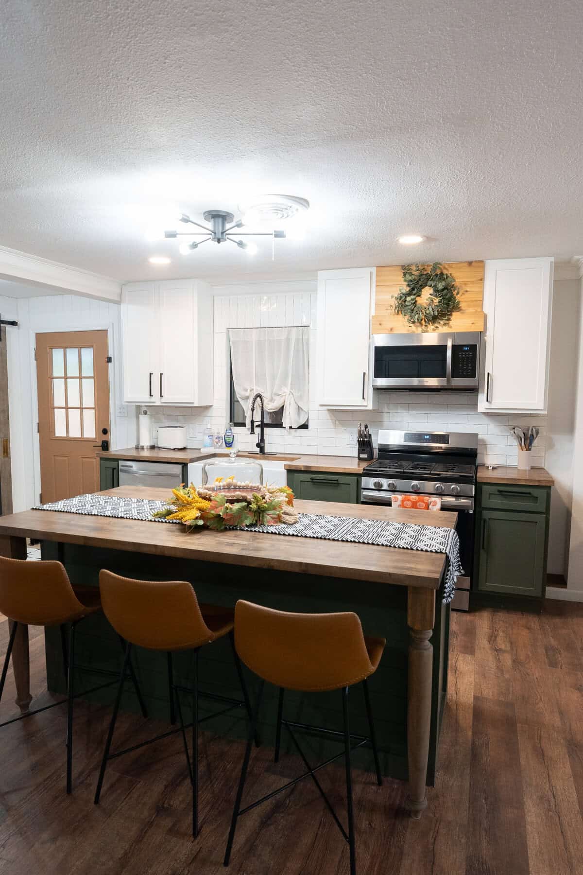 A cozy kitchen featuring a wooden table surrounded by chairs