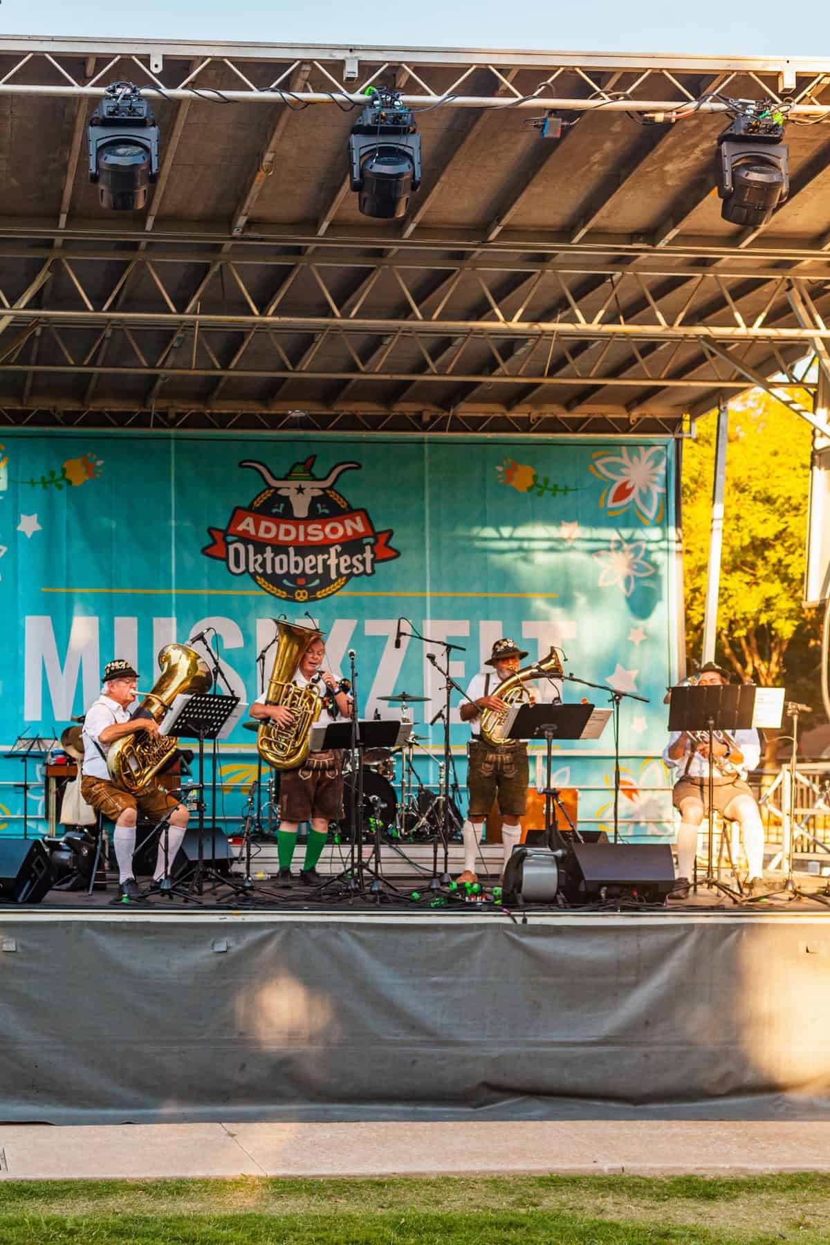 Brass band performing on stage at Addison Oktoberfest event.