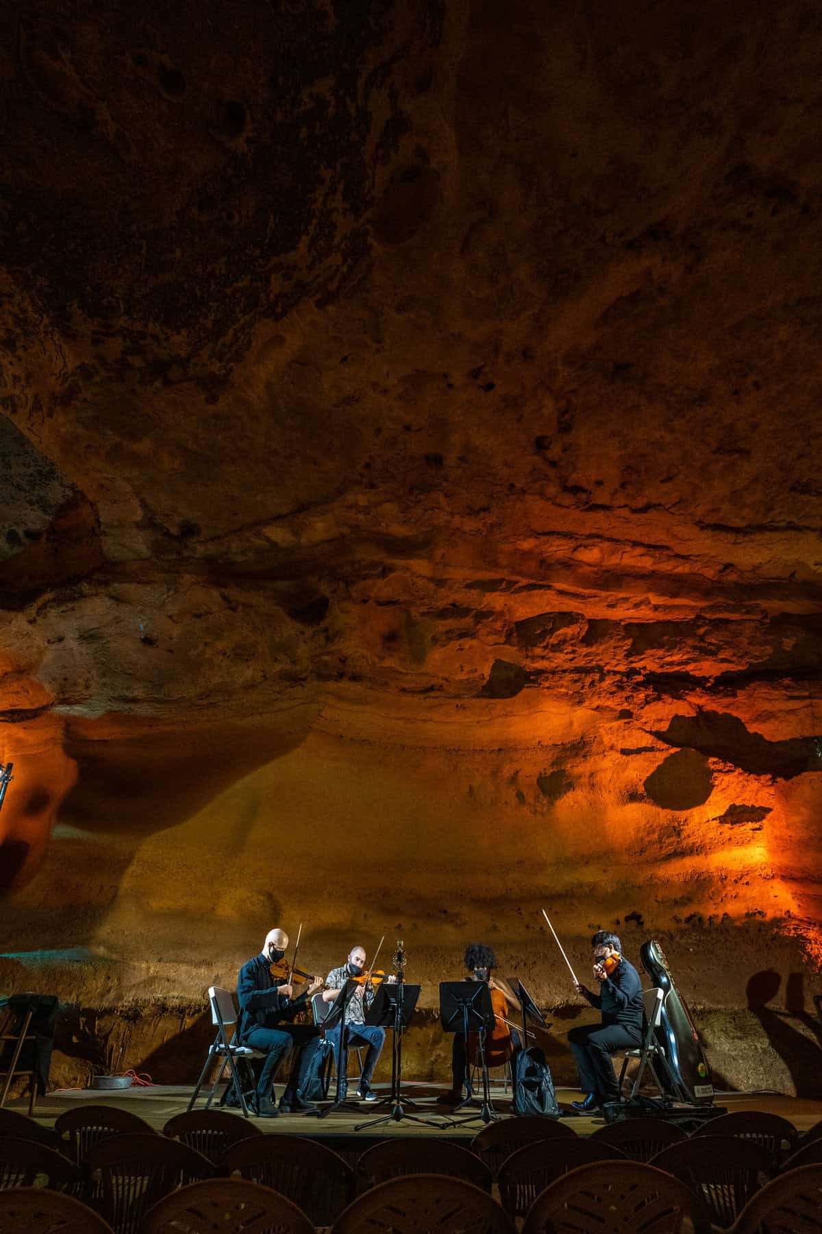 Quartet performing in a cave