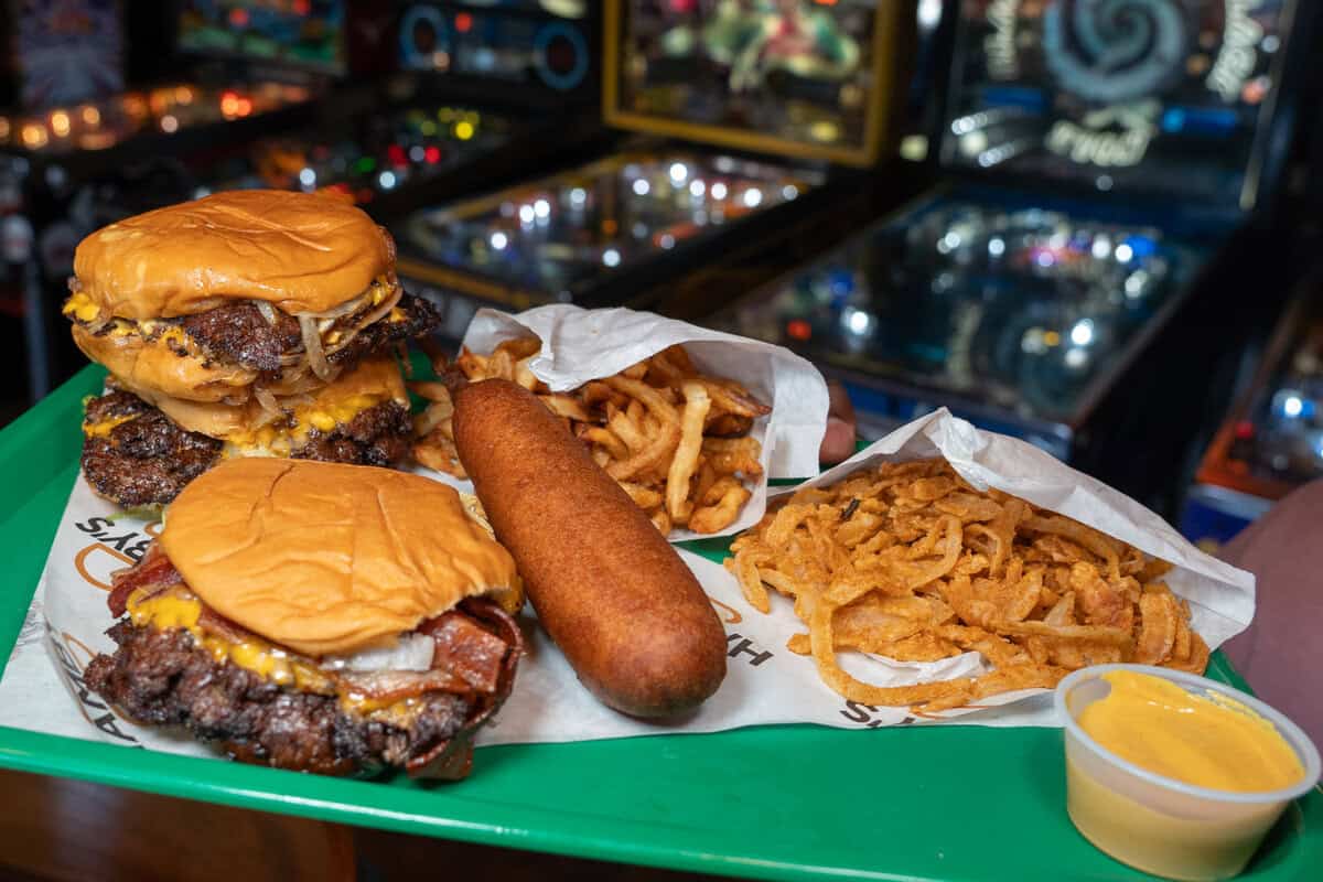 A double cheeseburger, corn dog, fries, onion rings, and cheese sauce.