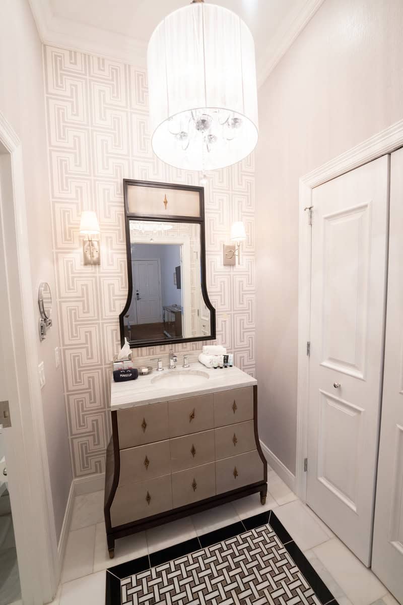 A modern bathroom with a sink, toilet, and shower, designed for comfort and functionality.